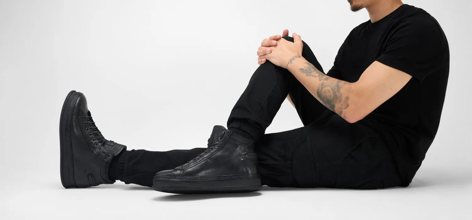 COLE rugged-black welted distressed high sneakers.
