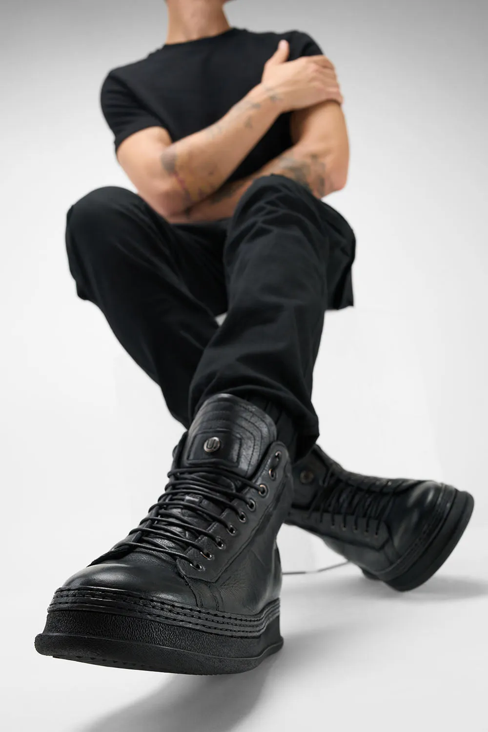 COLE rugged-black welted distressed high sneakers.
